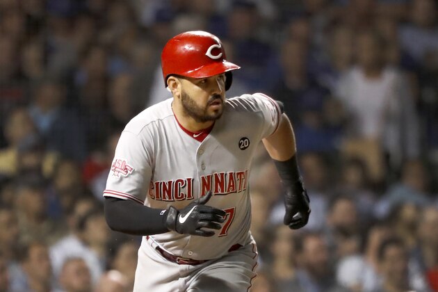 Cincinnati Reds' Eugenio Suarez watches his RBI single off Chicago Cubs starting pitcher Yu Darvish during the fifth inning of a baseball game Tuesday, Sept. 17, 2019, in Chicago. Sonny Gray scored on the play. (AP Photo/Charles Rex Arbogast)
