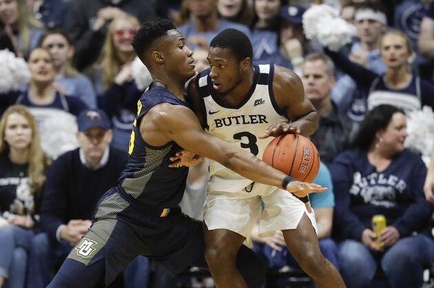 Butler's Kamar Baldwin (3) is defended by Marquette's Koby McEwen (25) during the second half of an NCAA college basketball game, Friday, Jan. 24, 2020, in Indianapolis. Butler won, 89-85, in overtime. (AP Photo/Darron Cummings)