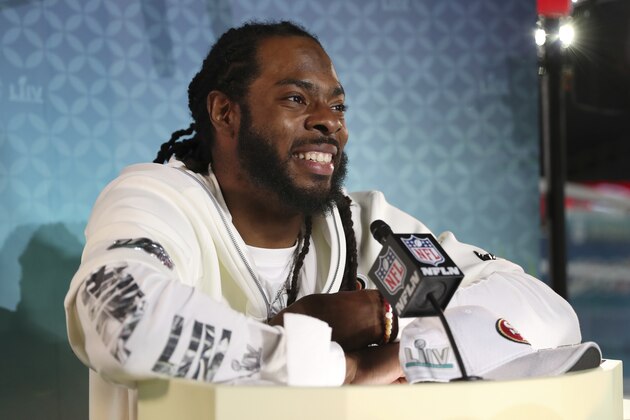 San Francisco 49ers cornerback Richard Sherman speaks to the media during Opening Night for the NFL Super Bowl 54 football game, Monday, Jan. 27, 2020, in Miami. (AP Photo/Steve Luciano)