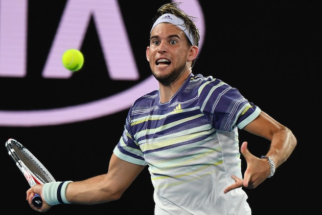 Austria's Dominic Thiem hits a return against Spain's Rafael Nadal during their men's singles quarter-final match on day ten of the Australian Open tennis tournament in Melbourne on January 29, 2020. (Photo by William WEST / AFP) / IMAGE RESTRICTED TO EDITORIAL USE - STRICTLY NO COMMERCIAL USE (Photo by WILLIAM WEST/AFP via Getty Images)