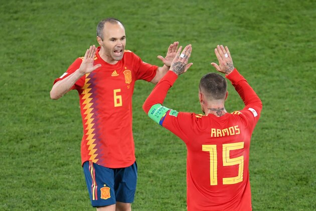 Spain's midfielder Andres Iniesta (L) and Spain's defender Sergio Ramos celebrate their second goal during the Russia 2018 World Cup Group B football match between Spain and Morocco at the Kaliningrad Stadium in Kaliningrad on June 25, 2018. (Photo by OZAN KOSE / AFP) / RESTRICTED TO EDITORIAL USE - NO MOBILE PUSH ALERTS/DOWNLOADS        (Photo credit should read OZAN KOSE/AFP via Getty Images)