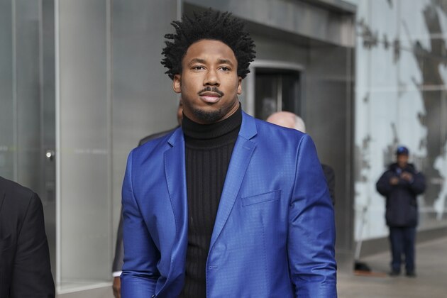 The Cleveland Browns Myles Garrett leaves an office building in New York, Wednesday, Nov. 20, 2019. The Browns star defensive end is asking the NFL to decrease his indefinite suspension. Garrett was banned last week for the rest of the regular season and playoffs for striking Pittsburgh quarterback Mason Rudolph with a helmet. Garrett is appealing the decision and his case is being heard Wednesday in New York by a league-appointed officer who will either lessen the penalty or put a definitive number of games on it. (AP Photo/Seth Wenig)