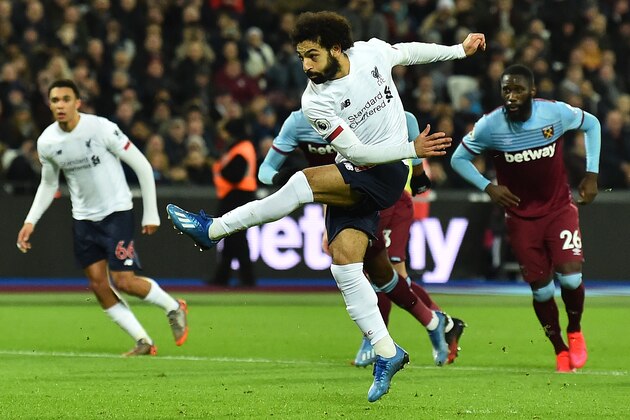 Liverpool's Egyptian midfielder Mohamed Salah scores the opening goal from the penalty spot during the English Premier League football match between West Ham United and Liverpool at The London Stadium, in east London on January 29, 2020. (Photo by Glyn KIRK / AFP) / RESTRICTED TO EDITORIAL USE. No use with unauthorized audio, video, data, fixture lists, club/league logos or 'live' services. Online in-match use limited to 120 images. An additional 40 images may be used in extra time. No video emulation. Social media in-match use limited to 120 images. An additional 40 images may be used in extra time. No use in betting publications, games or single club/league/player publications. /  (Photo by GLYN KIRK/AFP via Getty Images)