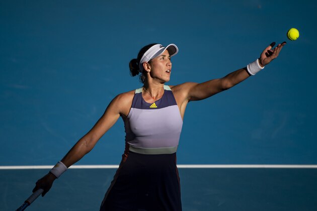 MELBOURNE, AUSTRALIA - JANUARY 30: Garbine Muguruza of Spain serves in her semi-final match against Simona Halep of Romania on day eleven of the 2020 Australian Open at Melbourne Park on January 30, 2020 in Melbourne, Australia. (Photo by TPN/Getty Images) MELBOURNE, AUSTRALIA - JANUARY 30: Garbine Muguruza of Spain serves in her semi-final match against Simona Halep of Romania on day eleven of the 2020 Australian Open at Melbourne Park on January 30, 2020 in Melbourne, Australia. (Photo by TPN/Getty Images)