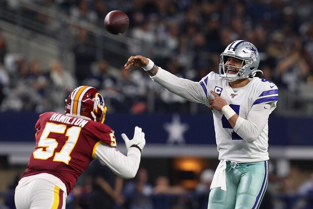 ARLINGTON, TEXAS - DECEMBER 29: Dak Prescott #4 of the Dallas Cowboys passes under pressure from Shaun Dion Hamilton #51 of the Washington Redskins in the third quarter at AT&T Stadium on December 29, 2019 in Arlington, Texas. (Photo by Richard Rodriguez/Getty Images)