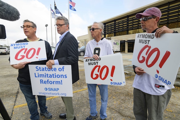 Members of SNAP, the Survivors Network of those Abused by Priests, including Kevin Bourgeois, left, John Gianoli, Richard Windmann, and John Anderson, hold signs during a conference in front of the New Orleans Saints training facility in Metairie, La., Wednesday Jan. 29, 2020. SNAP is demanding that Gayle Benson, the owner of the NFL Saints and NBA Pelicans, release all emails where the Saints provided public relations assistance to the Catholic Archdiocese of New Orleans regarding clergy sexual abuse cases. The sign Members of SNAP, the Survivors Network of those Abused by Priests, including Kevin Bourgeois, left, John Gianoli, Richard Windmann, and John Anderson, hold signs during a conference in front of the New Orleans Saints training facility in Metairie, La., Wednesday Jan. 29, 2020. SNAP is demanding that Gayle Benson, the owner of the NFL Saints and NBA Pelicans, release all emails where the Saints provided public relations assistance to the Catholic Archdiocese of New Orleans regarding clergy sexual abuse cases. The sign
