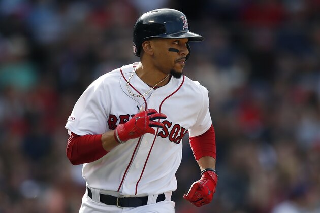 Boston Red Sox's Mookie Betts runs on his single during the third inning of a baseball game against the Los Angeles Angels in Boston, Saturday, Aug. 10, 2019. (AP Photo/Michael Dwyer)