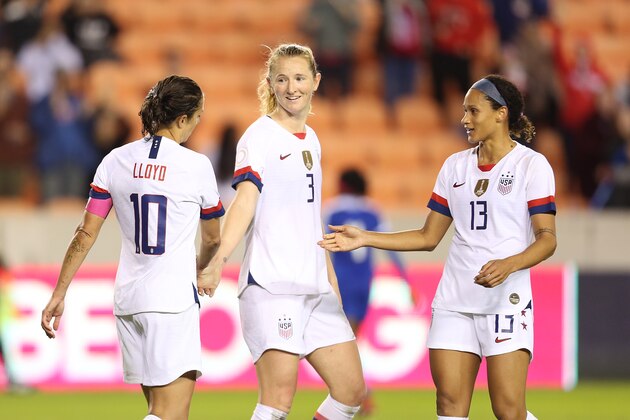 HOUSTON, TX - JANUARY 28: Captain Carli Lloyd #10, Samantha Mewis #3 and Lynn Williams #13 of USA celebrate the 4th goal during the group A game between United States and Haiti as part of the CONCACAF Women's Olympic Qualifying at BBVA Compass Stadium on January 28, 2020 in Houston, Texas.  (Photo by Omar Vega/Getty Images)