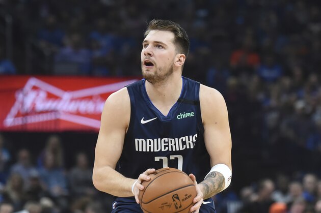 Dallas Mavericks guard Luka Doncic (77) sets up a shot in the first half of an NBA basketball game against Oklahoma City Thunder, Monday, Jan. 27, 2020, in Oklahoma City. (AP Photo/Kyle Phillips)