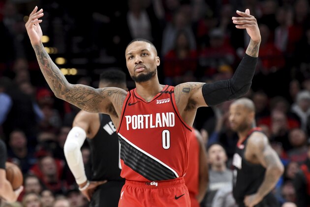 Portland Trail Blazers guard Damian Lillard urges on the crowd after scoring during the second half of the team's NBA basketball game against the Houston Rockets in Portland, Ore., Wednesday, Jan. 29, 2020. The Blazers won 125-112. (AP Photo/Steve Dykes) Portland Trail Blazers guard Damian Lillard urges on the crowd after scoring during the second half of the team's NBA basketball game against the Houston Rockets in Portland, Ore., Wednesday, Jan. 29, 2020. The Blazers won 125-112. (AP Photo/Steve Dykes)