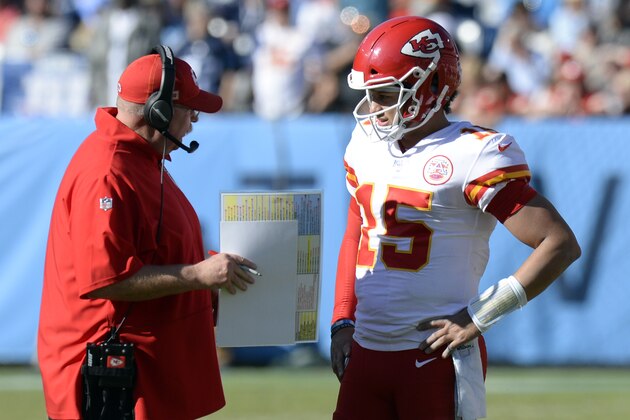 Kansas City Chiefs head coach Andy Reid talks with quarterback Patrick Mahomes in the first half of an NFL football game against the Tennessee Titans Sunday, Nov. 10, 2019, in Nashville, Tenn. (AP Photo/Mark Zaleski)