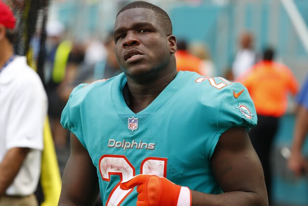 Miami Dolphins running back Frank Gore (21) waits on the sidelines, during the second half of an NFL football game, Sunday against the New York Jets, Nov. 4, 2018, in Miami Gardens, Fla. (AP Photo/Wilfredo Lee)