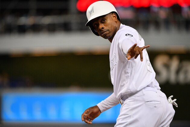MIAMI, FL - AUGUST 23: Curtis Granderson #21 of the Miami Marlins points to a fan in the fifth inning against the Philadelphia Phillies at Marlins Park on August 23, 2019 in Miami, Florida. Teams are wearing special color schemed uniforms with players choosing nicknames to display for Players' Weekend. (Photo by Mark Brown/Getty Images)