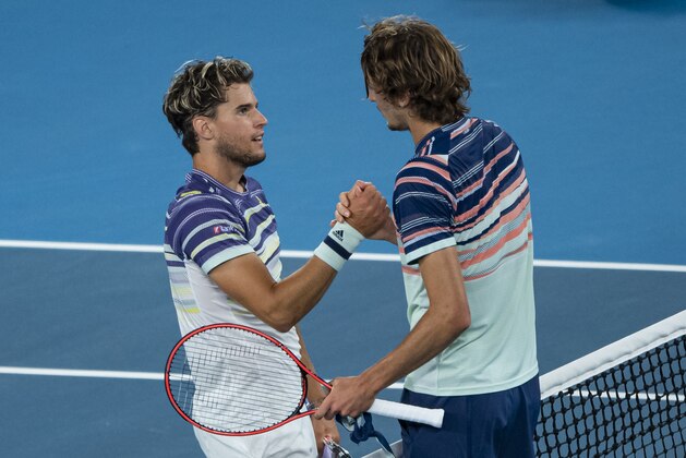 MELBOURNE, AUSTRALIA - JANUARY 31: Dominic Thiem of Austria shakes hands with Alexander Zverev of Germany after beating him in the semi-final of the men's singles on day twelve of the 2020 Australian Open at Melbourne Park on January 31, 2020 in Melbourne, Australia. (Photo by TPN/Getty Images)