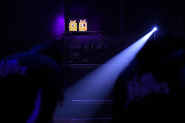 The retired jerseys of late Los Angeles Lakers player Kobe Bryant hangs in the rafters during a moment of silence prior to an NBA basketball game between the Los Angeles Clippers and the Sacramento Kings in Los Angeles, Thursday, Jan. 30, 2020. (AP Photo/Kelvin Kuo)