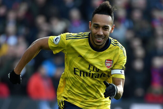 Arsenal's Gabonese striker Pierre-Emerick Aubameyang controls the ball during the English Premier League football match between Crystal Palace and Arsenal at Selhurst Park in south London on January 11, 2020. (Photo by DANIEL LEAL-OLIVAS / AFP) / RESTRICTED TO EDITORIAL USE. No use with unauthorized audio, video, data, fixture lists, club/league logos or 'live' services. Online in-match use limited to 120 images. An additional 40 images may be used in extra time. No video emulation. Social media in-match use limited to 120 images. An additional 40 images may be used in extra time. No use in betting publications, games or single club/league/player publications. /  (Photo by DANIEL LEAL-OLIVAS/AFP via Getty Images)