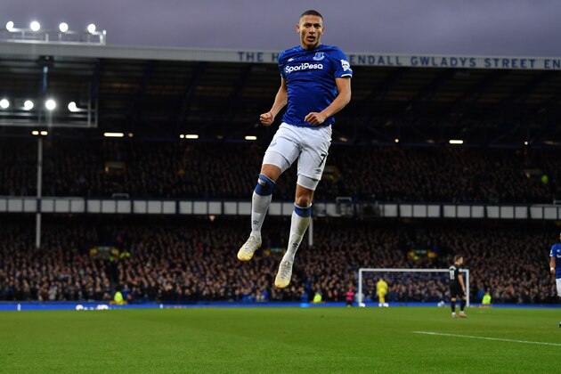 Everton's Brazilian striker Richarlison celebrates after scoring the opening goal of the English Premier League football match between Everton and Brighton Hove and Albion at Goodison Park in Liverpool, north west England on January 11, 2020. (Photo by Paul ELLIS / AFP) / RESTRICTED TO EDITORIAL USE. No use with unauthorized audio, video, data, fixture lists, club/league logos or 'live' services. Online in-match use limited to 120 images. An additional 40 images may be used in extra time. No video emulation. Social media in-match use limited to 120 images. An additional 40 images may be used in extra time. No use in betting publications, games or single club/league/player publications. /  (Photo by PAUL ELLIS/AFP via Getty Images)