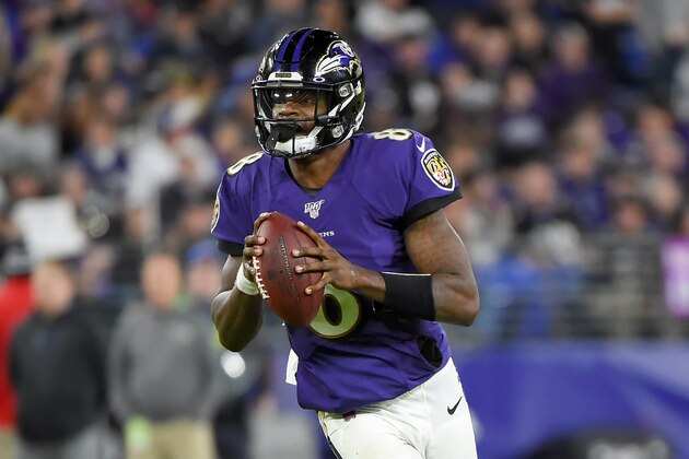 BALTIMORE, MARYLAND - JANUARY 11: Lamar Jackson #8 of the Baltimore Ravens looks to pass against the Tennessee Titans during the AFC Divisional Playoff game at M&T Bank Stadium on January 11, 2020 in Baltimore, Maryland. (Photo by Will Newton/Getty Images)