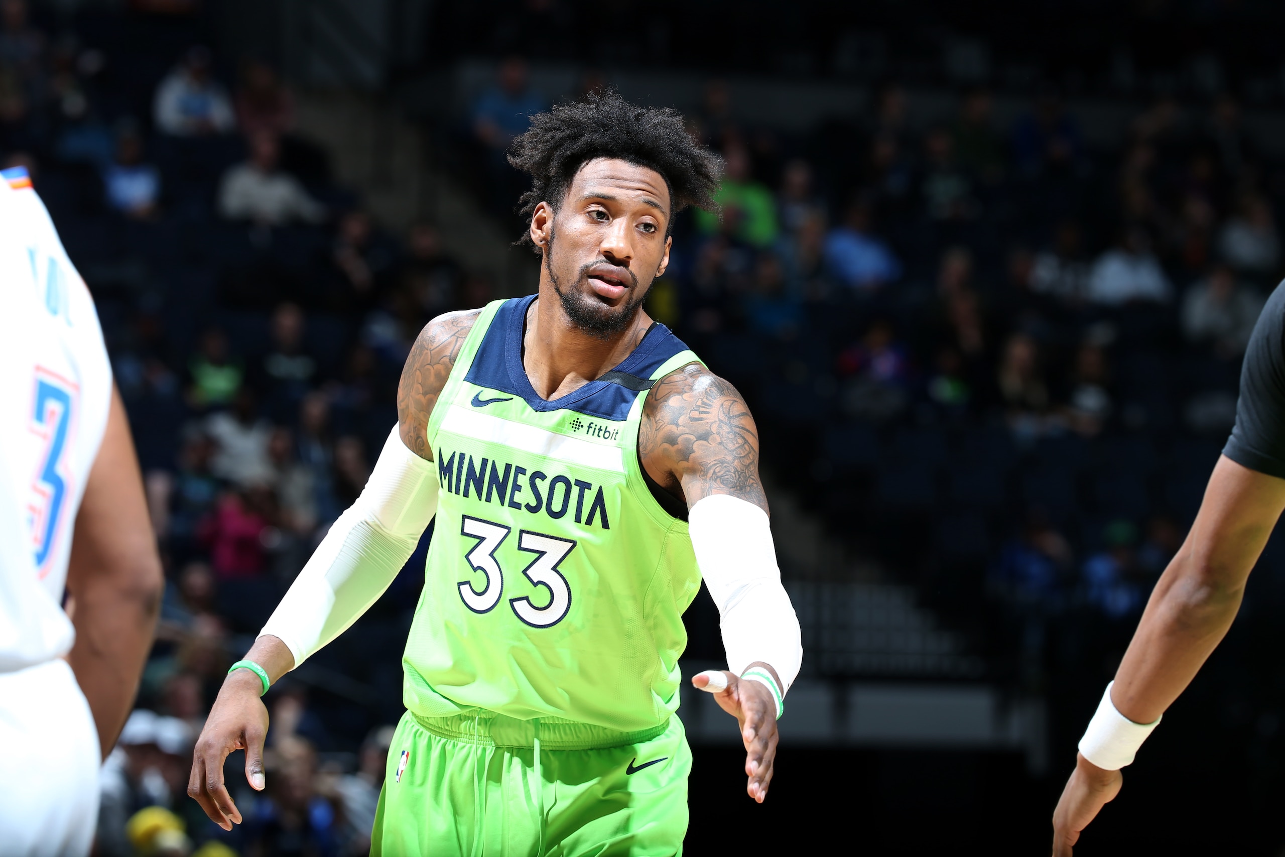 MINNEAPOLIS, MN -  JANUARY 25: Robert Covington #33 of the Minnesota Timberwolves high-fives teammate against the Oklahoma City Thunder on January 25, 2020 at Target Center in Minneapolis, Minnesota. NOTE TO USER: User expressly acknowledges and agrees that, by downloading and or using this Photograph, user is consenting to the terms and conditions of the Getty Images License Agreement. Mandatory Copyright Notice: Copyright 2020 NBAE (Photo by David Sherman/NBAE via Getty Images)