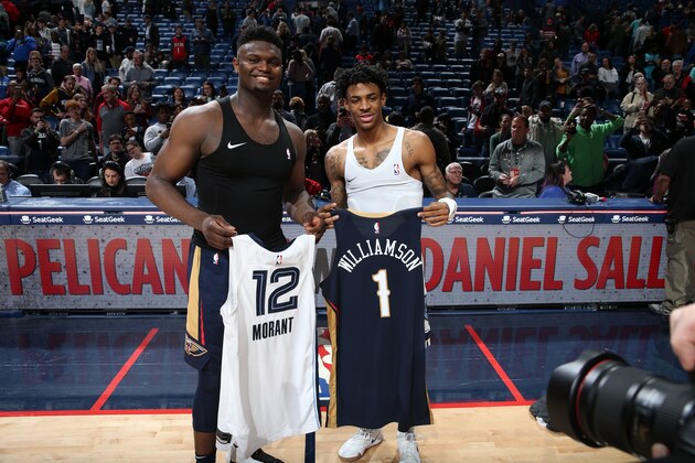 NEW ORLEANS, LA - JANUARY 31: Zion Williamson #1 of the New Orleans Pelicans and Ja Morant #12 of the Memphis Grizzlies swap jerseys after the game on January 31, 2020 at the Smoothie King Center in New Orleans, Louisiana. NOTE TO USER: User expressly acknowledges and agrees that, by downloading and or using this Photograph, user is consenting to the terms and conditions of the Getty Images License Agreement. Mandatory Copyright Notice: Copyright 2020 NBAE (Photo by Layne Murdoch Jr./NBAE via Getty Images) NEW ORLEANS, LA - JANUARY 31: Zion Williamson #1 of the New Orleans Pelicans and Ja Morant #12 of the Memphis Grizzlies swap jerseys after the game on January 31, 2020 at the Smoothie King Center in New Orleans, Louisiana. NOTE TO USER: User expressly acknowledges and agrees that, by downloading and or using this Photograph, user is consenting to the terms and conditions of the Getty Images License Agreement. Mandatory Copyright Notice: Copyright 2020 NBAE (Photo by Layne Murdoch Jr./NBAE via Getty Images)