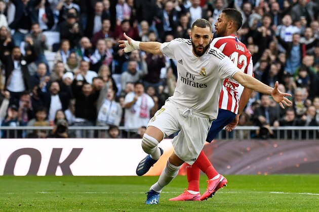 Real Madrid's French forward Karim Benzema celebrates after acoring a goal during the Spanish league football match between Real Madrid CF and Club Atletico de Madrid at the Santiago Bernabeu stadium in Madrid on February 1, 2020. (Photo by PIERRE-PHILIPPE MARCOU / AFP) (Photo by PIERRE-PHILIPPE MARCOU/AFP via Getty Images)