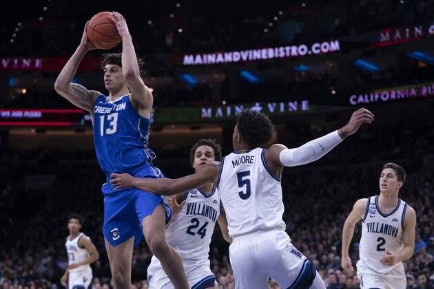 PHILADELPHIA, PA - FEBRUARY 01: Christian Bishop #13 of the Creighton Bluejays looks to pass the ball against Justin Moore #5 and Jeremiah Robinson-Earl #24 of the Villanova Wildcats in the first half at the Wells Fargo Center on February 1, 2020 in Philadelphia, Pennsylvania. (Photo by Mitchell Leff/Getty Images) PHILADELPHIA, PA - FEBRUARY 01: Christian Bishop #13 of the Creighton Bluejays looks to pass the ball against Justin Moore #5 and Jeremiah Robinson-Earl #24 of the Villanova Wildcats in the first half at the Wells Fargo Center on February 1, 2020 in Philadelphia, Pennsylvania. (Photo by Mitchell Leff/Getty Images)