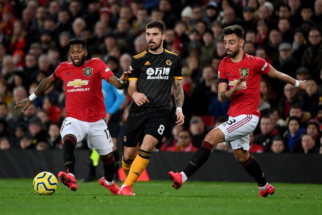 MANCHESTER, ENGLAND - FEBRUARY 01: Fred of Manchester United, Ruben Neves of Wolverhampton Wanderers and Bruno Fernandes of Manchester United during the Premier League match between Manchester United and Wolverhampton Wanderers at Old Trafford on February 1, 2020 in Manchester, United Kingdom. (Photo by Sam Bagnall - AMA/Getty Images)