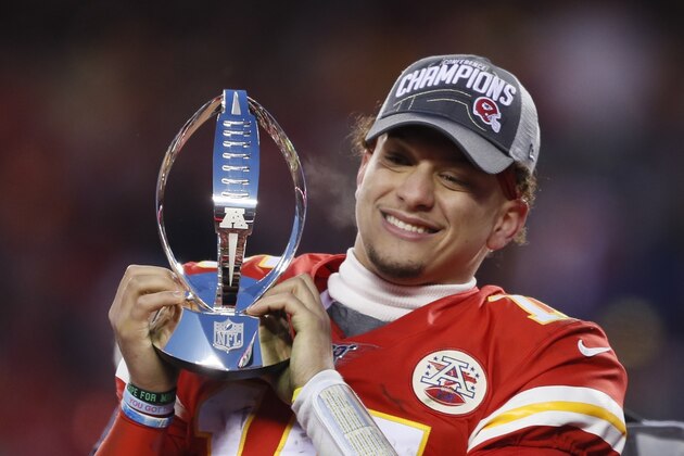 Kansas City Chiefs' Patrick Mahomes celebrates with the Lamar Hunt Trophy after the NFL AFC Championship football game against the Tennessee Titans Sunday, Jan. 19, 2020, in Kansas City, MO. The Chiefs won 35-24 to advance to Super Bowl 54. (AP Photo/Charlie Neibergall)