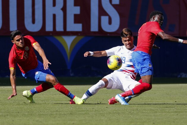 United States forward Ulysses Llanez, center, slides between Costa Rica midfielder Yeltsin Tejeda, left, and defender Keysher Fuller (4) during the first half of an international friendly soccer match in Carson, Calif., Saturday, Feb. 1, 2020. (AP Photo/Ringo H.W. Chiu) United States forward Ulysses Llanez, center, slides between Costa Rica midfielder Yeltsin Tejeda, left, and defender Keysher Fuller (4) during the first half of an international friendly soccer match in Carson, Calif., Saturday, Feb. 1, 2020. (AP Photo/Ringo H.W. Chiu)