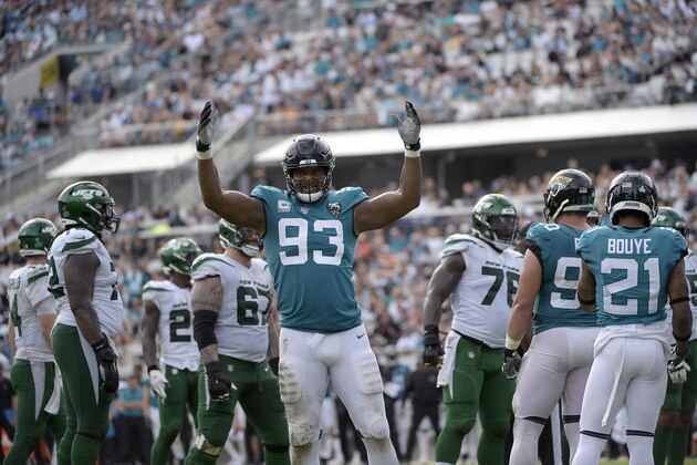 Jacksonville Jaguars defensive end Calais Campbell (93) encourages the crowd during the second half of an NFL football game against the New York Jets Sunday, Oct. 27, 2019, in Jacksonville, Fla. (AP Photo/Phelan M. Ebenhack)
