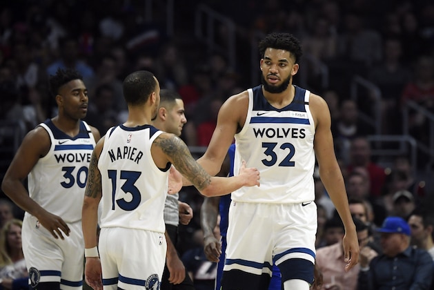 LOS ANGELES, CA - FEBRUARY 01: Karl-Anthony Towns #32 of the Minnesota Timberwolves is congratulated by Shabazz Napier #13 after scoring a basket against Los Angeles Clippers at Staples Center on February 1, 2020 in Los Angeles, California. NOTE TO USER: User expressly acknowledges and agrees that, by downloading and/or using this Photograph, user is consenting to the terms and conditions of the Getty Images License Agreement. (Photo by Kevork Djansezian/Getty Images)