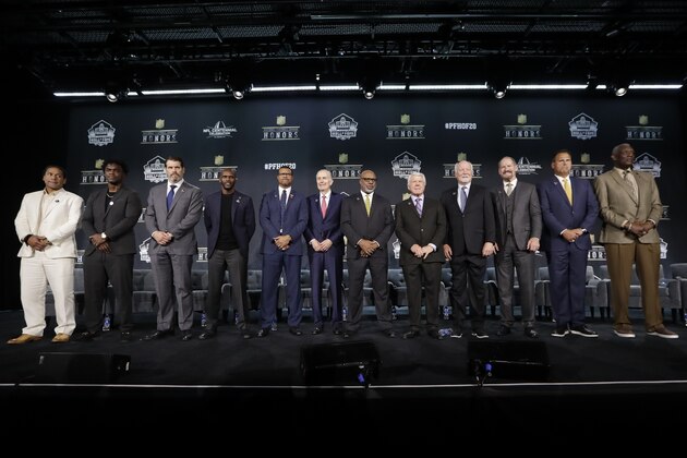 Hall of Fame Class of 2020, from left, Troy Polamalu, Edgerrin James, Steve Hutchinson, Isaac Bruce, Steve Atwater, Paul Tagliabue, Donnie Shell, Jimmie Johnson, Cliff Harris, Bill Cowher, Jimbo Covert, and Harold Carmichael pose at the NFL Honors football award show Saturday, Feb. 1, 2020, in Miami. (AP Photo/Mark Humphrey)