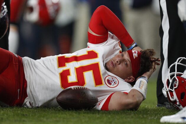 Kansas City Chiefs quarterback Patrick Mahomes (15) lies on the field after being injured against the Denver Broncos during the first half of an NFL football game, Thursday, Oct. 17, 2019, in Denver. (AP Photo/David Zalubowski)