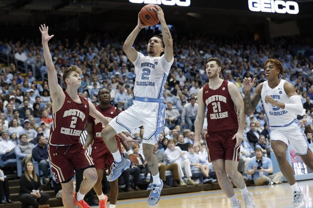 North Carolina guard Cole Anthony, center, drives to the basket while Boston College guard Julian Rishwain, left, and forward Nik Popovic (21) defend during the first half of an NCAA college basketball game in Chapel Hill, N.C., Saturday, Feb. 1, 2020. (AP Photo/Gerry Broome) North Carolina guard Cole Anthony, center, drives to the basket while Boston College guard Julian Rishwain, left, and forward Nik Popovic (21) defend during the first half of an NCAA college basketball game in Chapel Hill, N.C., Saturday, Feb. 1, 2020. (AP Photo/Gerry Broome)