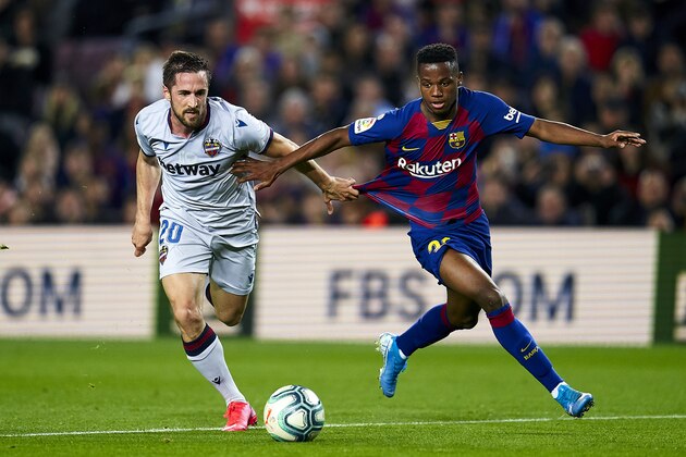 BARCELONA, SPAIN - FEBRUARY 02: Anssumane Fati of FC Barcelona competes for the ball with Jorge Miramon of Levante UD during the Liga match between FC Barcelona and Levante UD at Camp Nou on February 02, 2020 in Barcelona, Spain. (Photo by Quality Sport Images/Getty Images)