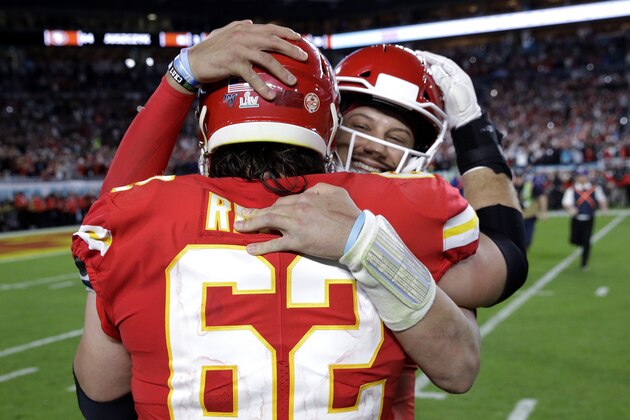 Kansas City Chiefs quarterback Patrick Mahomes (15) embraces Kansas City Chiefs' Austin Reiter (62) after a win against the San Francisco 49ers after the NFL Super Bowl 54 football game Sunday, Feb. 2, 2020, in Miami Gardens, Fla. The Kansas City Chiefs won 31-20. (AP Photo/Patrick Semansky)