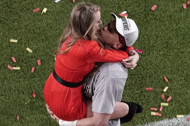 Kansas City Chiefs quarterback Patrick Mahomes (15) is kissed by his girlfriend Brittany Matthews, after the Chiefs' won the NFL Super Bowl 54 football game Sunday, Feb. 2, 2020, in Miami Gardens, Fla. The Chiefs' defeated the San Francisco 49ers 31-20. (AP Photo/Morry Gash)