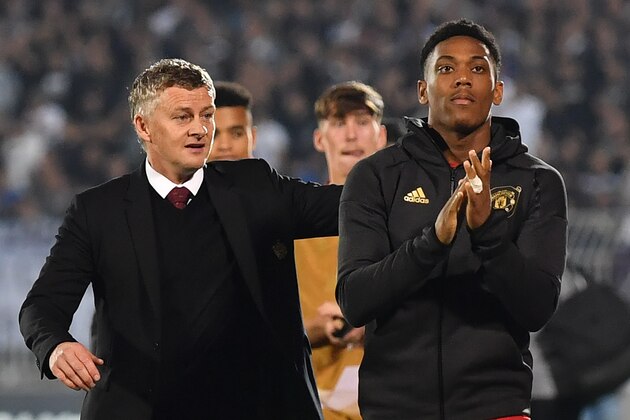 Manchester United's Norwegian manager Ole Gunnar Solskjaer (L) and Manchester United's French striker Anthony Martial gesture at the final whistle during the UEFA Europa league group L football match between Partizan Belgrade and Manchester United at the Partizan stadium in Belgrade on October 24, 2019. - Manchester United beat Partizan Belkgrade 1 - 0. (Photo by ANDREJ ISAKOVIC / AFP) (Photo by ANDREJ ISAKOVIC/AFP via Getty Images)