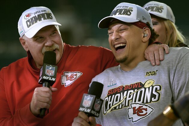 Kansas City Chiefs head coach Andy Reid, left, and quarterback Patrick Mahomes speak during a television interview after defeating the San Francisco 49ers in the NFL Super Bowl 54 football game Sunday, Feb. 2, 2020, in Miami Gardens, Fla. (AP Photo/Mark J. Terrill)