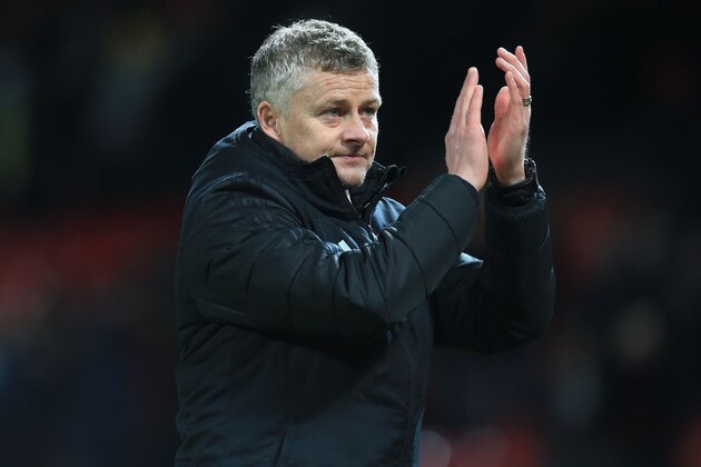 Manchester United's Norwegian manager Ole Gunnar Solskjaer applauds supporters on the pitch after the English Premier League football match between Manchester United and Wolverhampton Wanderers at Old Trafford in Manchester, north west England, on February 1, 2020. - The game finished 0-0. (Photo by Lindsey Parnaby / AFP) / RESTRICTED TO EDITORIAL USE. No use with unauthorized audio, video, data, fixture lists, club/league logos or 'live' services. Online in-match use limited to 120 images. An additional 40 images may be used in extra time. No video emulation. Social media in-match use limited to 120 images. An additional 40 images may be used in extra time. No use in betting publications, games or single club/league/player publications. /  (Photo by LINDSEY PARNABY/AFP via Getty Images)