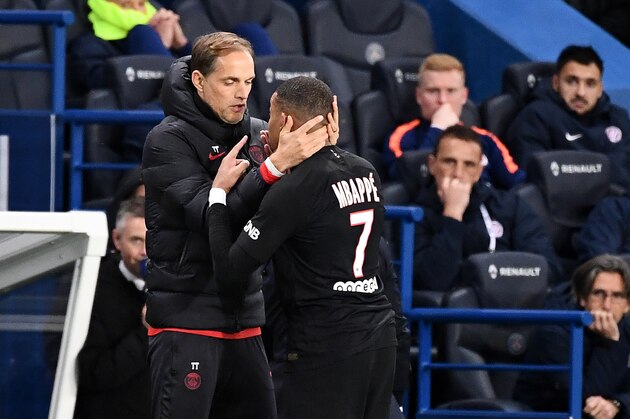 TOPSHOT - Paris Saint-Germain's French forward Kylian Mbappe (R) speaks with Paris Saint-Germain's German coach Thomas Tuchel as he leaves the pitch during the French L1 football match between Paris Saint-Germain (PSG) and Montpellier Herault SC at the Parc des Princes stadium in Paris, on February 1, 2020. (Photo by FRANCK FIFE / AFP) (Photo by FRANCK FIFE/AFP via Getty Images)