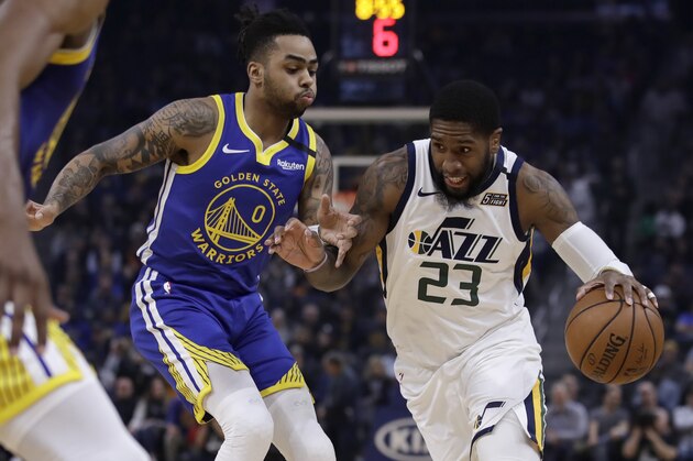 Utah Jazz forward Royce O'Neale, right, drives the ball against Golden State Warriors' D'Angelo Russell (0) in the first half of an NBA basketball game Wednesday, Jan. 22, 2020, in San Francisco. (AP Photo/Ben Margot)