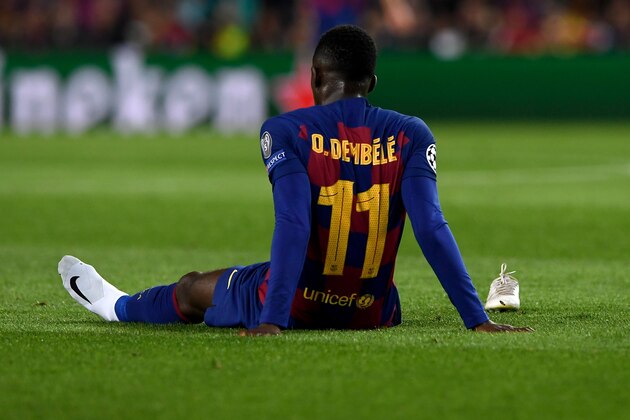 Barcelona's French forward Ousmane Dembele sits on the ground after an injury during the UEFA Champions League Group F football match between FC Barcelona and Borussia Dortmund at the Camp Nou stadium in Barcelona, on November 27, 2019. (Photo by Josep LAGO / AFP) (Photo by JOSEP LAGO/AFP via Getty Images)