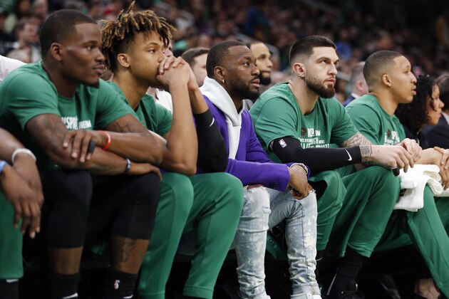 Boston Celtics' Kemba Walker, center, sits on the bench during the first half of an NBA basketball game against the Philadelphia 76ers in Boston, Saturday, Feb. 1, 2020. (AP Photo/Michael Dwyer) Boston Celtics' Kemba Walker, center, sits on the bench during the first half of an NBA basketball game against the Philadelphia 76ers in Boston, Saturday, Feb. 1, 2020. (AP Photo/Michael Dwyer)