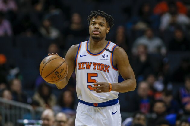 New York Knicks guard Dennis Smith Jr. brings the ball up court against the Charlotte Hornets in the second half of an NBA basketball game in Charlotte, N.C., Tuesday, Jan. 28, 2020. Charlotte won 97-92. (AP Photo/Nell Redmond) New York Knicks guard Dennis Smith Jr. brings the ball up court against the Charlotte Hornets in the second half of an NBA basketball game in Charlotte, N.C., Tuesday, Jan. 28, 2020. Charlotte won 97-92. (AP Photo/Nell Redmond)