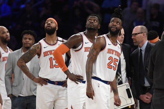 NEW YORK, NEW YORK - JANUARY 18: Reggie Bullock #25, Julius Randle #30, and Marcus Morris Sr. #13 of the New York Knicks wait for a decision during a replay review during the second half against the Philadelphia 76ers at Madison Square Garden on January 18, 2020 in New York City. NOTE TO USER: User expressly acknowledges and agrees that, by downloading and or using this photograph, User is consenting to the terms and conditions of the Getty Images License Agreement. (Photo by Sarah Stier/Getty Images)