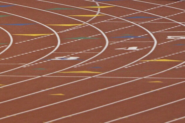 San Antonio Reagan High School's Wyatt Stuckness competes in the boys' 400-meter dash wheelchair event at the UIL State Track & Field meet, Saturday, May 10, 2014, in Austin, Texas.  Stuckness raced using only his right arm. (AP Photo/Michael Thomas)