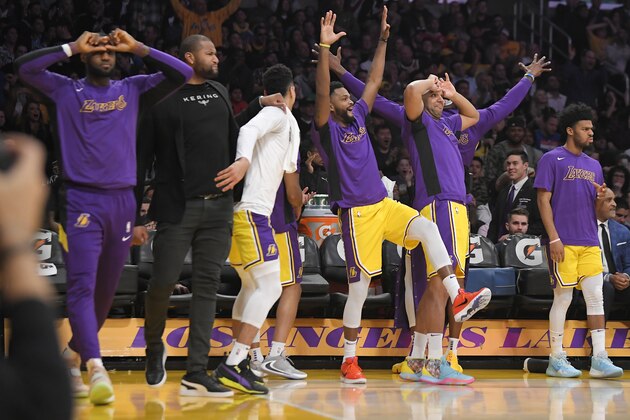 Los Angeles Lakers celebrate from the bench after guard Alex Caruso scored during the first half of the team's NBA basketball game against the New York Knicks on Tuesday, Jan. 7, 2020, in Los Angeles. (AP Photo/Mark J. Terrill) Los Angeles Lakers celebrate from the bench after guard Alex Caruso scored during the first half of the team's NBA basketball game against the New York Knicks on Tuesday, Jan. 7, 2020, in Los Angeles. (AP Photo/Mark J. Terrill)