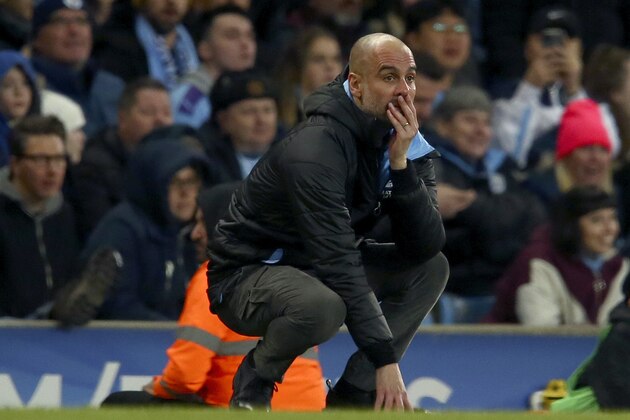 Manchester City's head coach Pep Guardiola reacts after a missed chance to score during the English League Cup semifinal second leg soccer match between Manchester City and Manchester United at Etihad stadium in Manchester, England, Wednesday, Jan. 29, 2020. (AP Photo/Dave Thompson)
