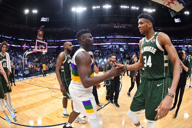 NEW ORLEANS, LA - FEBRUARY 4: Zion Williamson #1 of the New Orleans Pelicans and Giannis Antetokounmpo #34 of the Milwaukee Bucks high-five after a game on February 4, 2020 at the Smoothie King Center in New Orleans, Louisiana. NOTE TO USER: User expressly acknowledges and agrees that, by downloading and or using this Photograph, user is consenting to the terms and conditions of the Getty Images License Agreement. Mandatory Copyright Notice: Copyright 2020 NBAE (Photo by Jesse D. Garrabrant/NBAE via Getty Images)